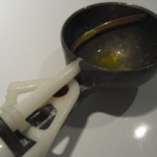 Spray ice cream scoop or use olive oil.